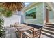 Charming patio with wooden dining table and chairs, perfect for outdoor dining at 40 Morris St, Charleston, SC 29403
