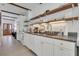 Modern white kitchen with floating shelves and granite countertops at 40 Morris St, Charleston, SC 29403