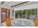 Dining area with round table and chairs, overlooking a patio at 40 Morris St, Charleston, SC 29403