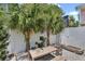 Charming patio with a fire pit and a wooden dining set at 40 Morris St, Charleston, SC 29403
