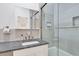 Modern bathroom with a walk-in shower, granite countertop, and updated fixtures at 40 Morris St, Charleston, SC 29403