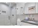 Modern bathroom with walk-in shower and granite countertop at 40 Morris St, Charleston, SC 29403