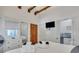 King bed, TV, and en-suite bathroom with walk-in shower at 40 Morris St, Charleston, SC 29403