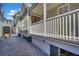 Side yard with a paved walkway and white fence at 40 Morris St, Charleston, SC 29403