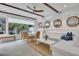 Bright living room with white sectional sofa and dining area at 40 Morris St, Charleston, SC 29403