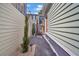 Landscaped side yard with a brick walkway and privacy fence at 40 Morris St, Charleston, SC 29403
