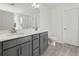 Double vanity bathroom with gray cabinets and tile flooring at 123 Ashley Cove Way, Summerville, SC 29483