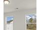 Well-lit bedroom featuring two windows with backyard views at 123 Ashley Cove Way, Summerville, SC 29483