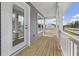 Covered porch with wood flooring and view of neighborhood at 123 Ashley Cove Way, Summerville, SC 29483