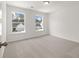 Spacious bedroom with two windows and neutral carpeting at 123 Ashley Cove Way, Summerville, SC 29483