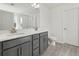 Double vanity bathroom with gray cabinets and quartz countertops at 123 Ashley Cove Way, Summerville, SC 29483