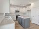 Modern kitchen with white cabinets, gray island and stainless steel appliances at 123 Ashley Cove Way, Summerville, SC 29483