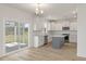 Modern kitchen with white cabinets, gray island and stainless steel appliances at 123 Ashley Cove Way, Summerville, SC 29483