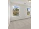 Bright bedroom with two large windows and neutral carpeting at 123 Ashley Cove Way, Summerville, SC 29483