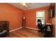 Bright bedroom with wood floors, window, and ceiling fan at 7828 Peppercorn Ln, North Charleston, SC 29420