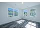 Bright bedroom with gray vinyl plank flooring and large windows at 420 Carolina Cherry Ct # 203, Charleston, SC 29414