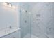 Modern bathroom with white vanity, a walk-in shower, and marble tile at 420 Carolina Cherry Ct # 203, Charleston, SC 29414
