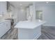 Modern kitchen featuring white shaker cabinets, quartz countertops, and stainless steel appliances at 420 Carolina Cherry Ct # 203, Charleston, SC 29414