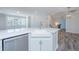 Open concept kitchen with white cabinets, farmhouse sink, and stainless steel appliances at 420 Carolina Cherry Ct # 203, Charleston, SC 29414
