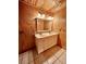 Bathroom with double vanity and wood walls at 3001 Buccaneer Rd, Isle of Palms, SC 29451