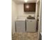 Laundry area with washer, dryer, and overhead cabinets at 224 Ruth Anne Dr, Summerville, SC 29483