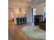 Living room features wood-look floors, a fireplace, and a comfy recliner at 224 Ruth Anne Dr, Summerville, SC 29483