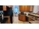 Open kitchen with island and view into dining area at 9120 Parlor Dr, Ladson, SC 29456