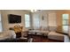 Cozy living room featuring a fireplace and large sectional sofa at 9120 Parlor Dr, Ladson, SC 29456