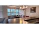 Charming dining area with a chandelier and plenty of window light at 9120 Parlor Dr, Ladson, SC 29456