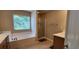 Bathroom with soaking tub, shower, and double vanity at 9120 Parlor Dr, Ladson, SC 29456