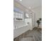 Bright bathroom features large tub, shower, herringbone floor, and natural light at 702 Maynard Ln, Summerville, SC 29486