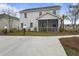 Charming two-story home featuring a screened-in porch and landscaped yard at 702 Maynard Ln, Summerville, SC 29486