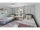 Charming bedroom with twin beds, light walls, and a workspace at 702 Maynard Ln, Summerville, SC 29486