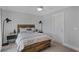 Cozy bedroom with wood bed frame and accent wall at 702 Maynard Ln, Summerville, SC 29486