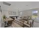 Bright game room with a pool table, comfortable seating, and large windows at 702 Maynard Ln, Summerville, SC 29486