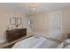 Spacious bedroom with dresser, neutral walls, and an en-suite bathroom at 702 Maynard Ln, Summerville, SC 29486