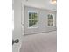 Bright bedroom with two windows that overlook trees at 111 Ashley Cove Way, Summerville, SC 29483