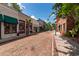 Charming street view featuring brick-paved road lined with storefronts under a sunny, blue sky at 111 Ashley Cove Way, Summerville, SC 29483