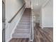Modern entryway with carpeted stairs and luxury vinyl plank flooring at 111 Ashley Cove Way, Summerville, SC 29483