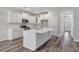 Modern kitchen with white cabinets, quartz countertops, and stainless steel appliances at 111 Ashley Cove Way, Summerville, SC 29483