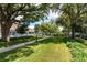 Picturesque town square park with green grass, walking path, and shade trees at 111 Ashley Cove Way, Summerville, SC 29483