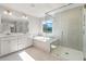 Bright bathroom features a double sink vanity, soaking tub, and glass shower at 111 Ashley Cove Way, Summerville, SC 29483