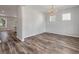 Bright dining room features hardwood floors and a chandelier at 111 Ashley Cove Way, Summerville, SC 29483
