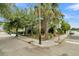 Corner lot view of home nestled amongst lush greenery and mature trees at 66 Cooper St, Charleston, SC 29403