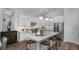 Modern kitchen featuring white cabinets, stainless steel appliances, and a large island at 66 Cooper St, Charleston, SC 29403