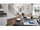 Home office with built-in shelving and hardwood floors at 66 Cooper St, Charleston, SC 29403