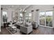 Bright living room with hardwood floors, large windows, and comfortable seating at 66 Cooper St, Charleston, SC 29403