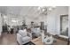 Open concept living room with hardwood floors and kitchen views at 66 Cooper St, Charleston, SC 29403