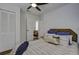 Charming bedroom with striped bedding, a ceiling fan, and built-in closet at 27 Allway St, Charleston, SC 29403