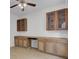 Home office featuring built-in wooden cabinets and desk at 124 Sweet Alyssum Dr, Ladson, SC 29456